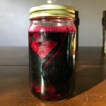 a jar filled with scraps of beets, salt and water to make beet kvass
