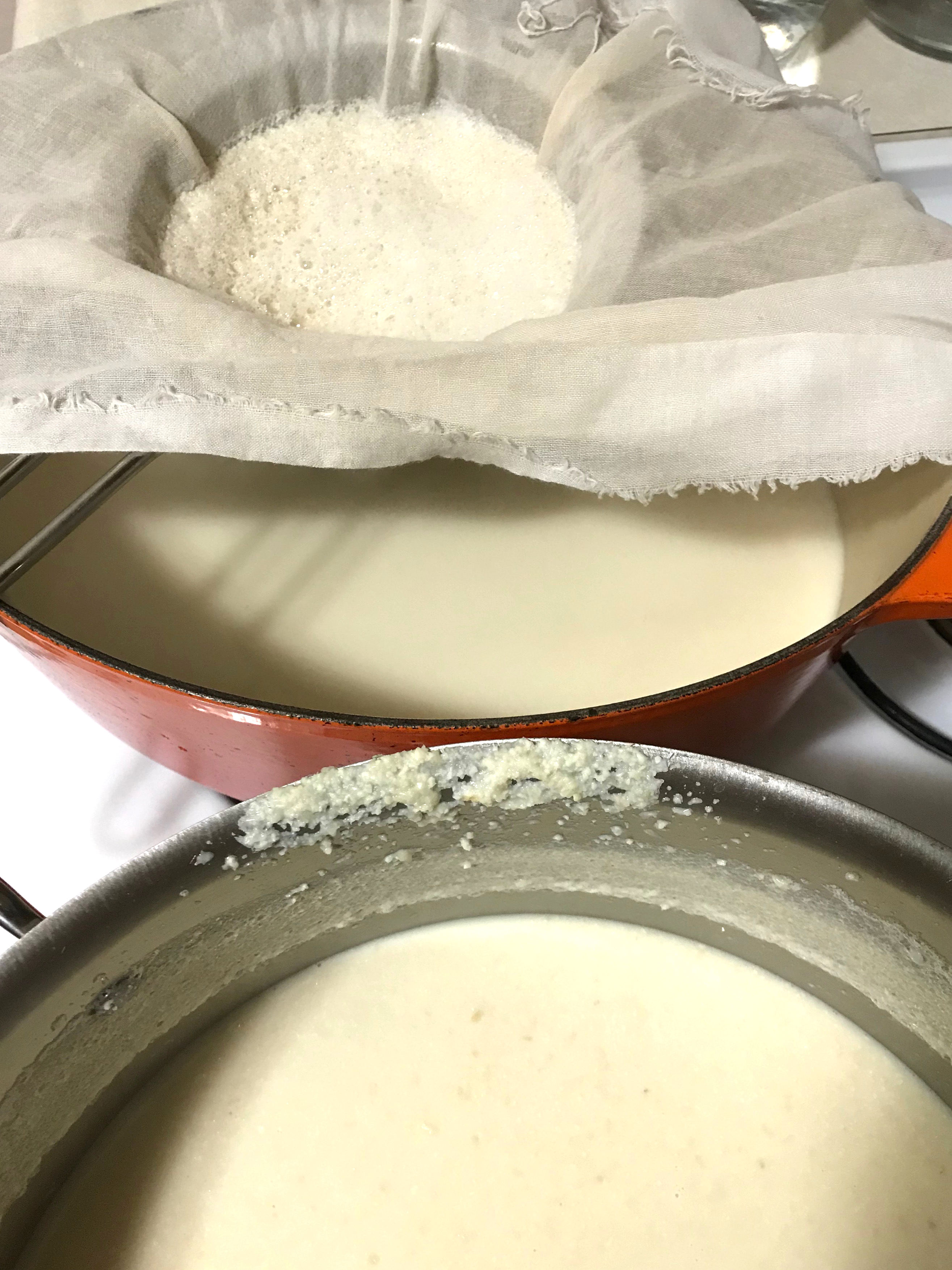 straining homemade soy milk