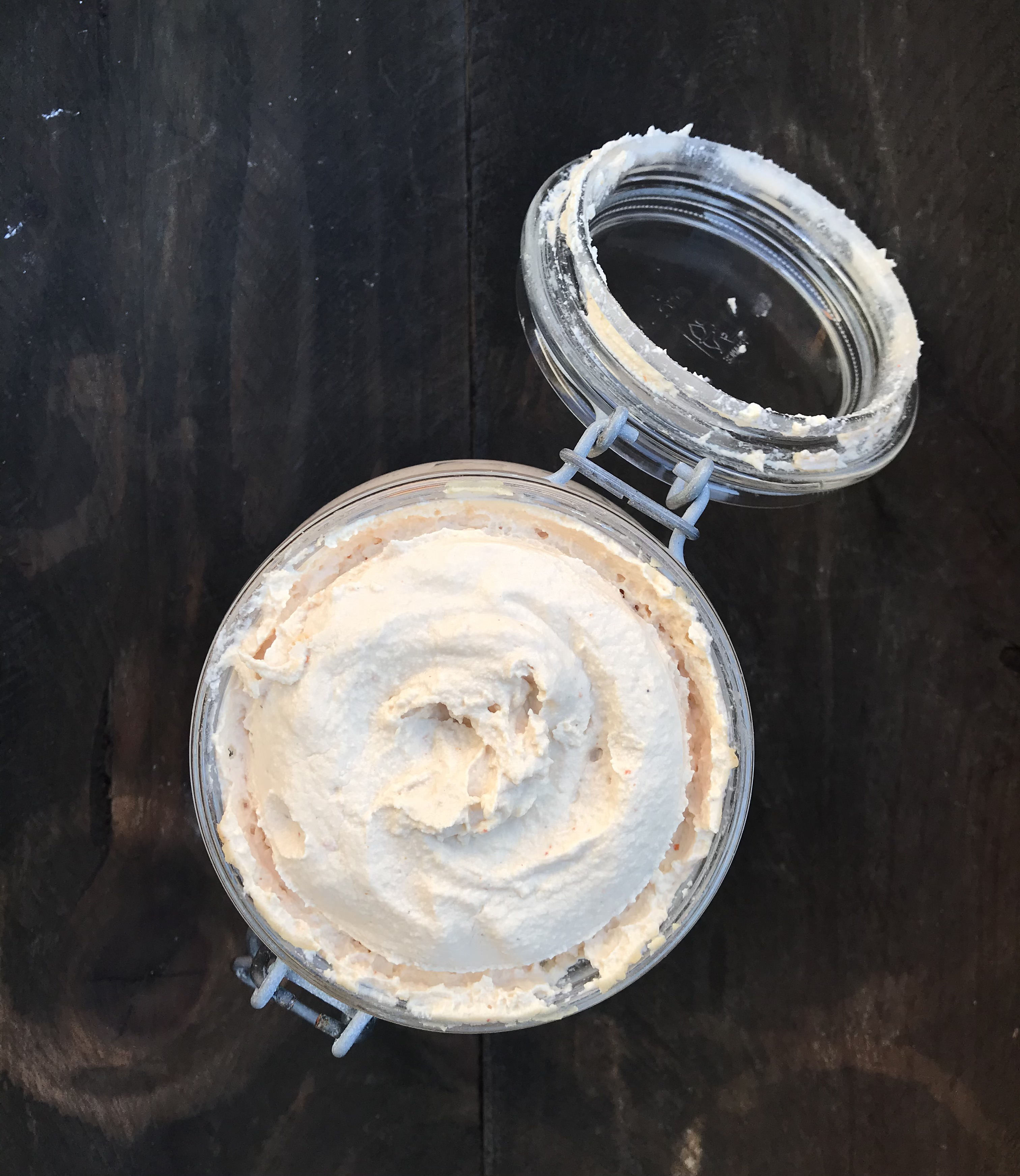 flat lay of cultured cashew cheese in a bale-top jar