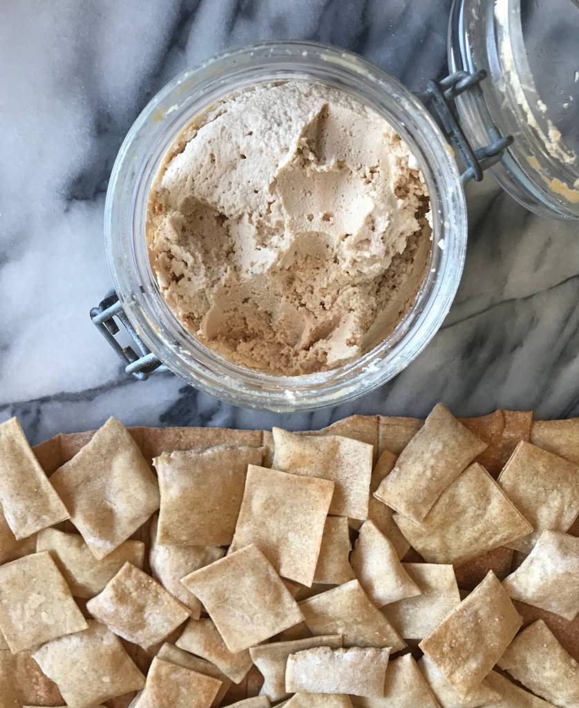jar of cashew cheese with sourdough crackers
