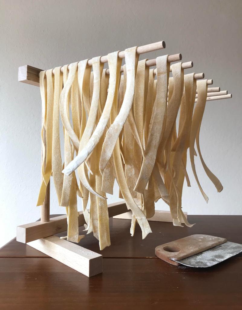 pasta drying on a pasta rack