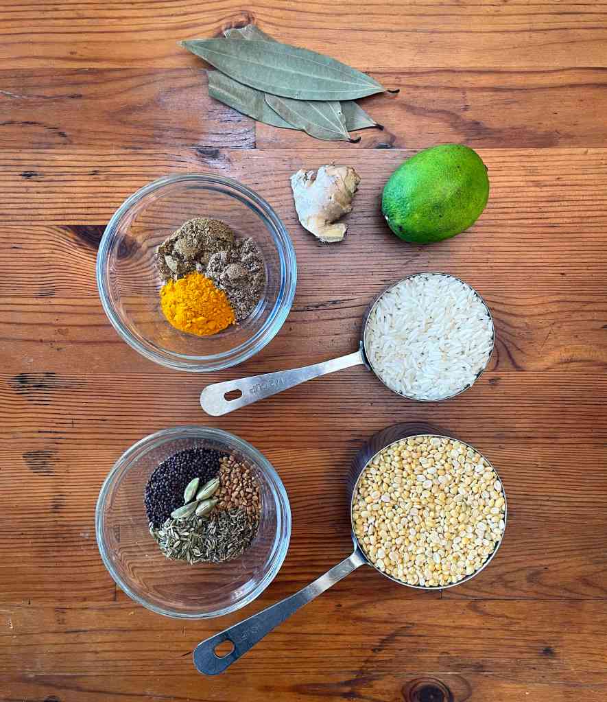 a wooden table with ingredients spread across it for making khichdi