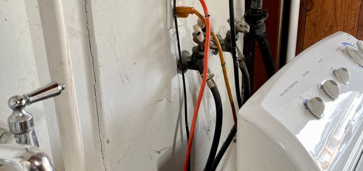 A washing machine is hooked to pipes and a valve for a greywater system