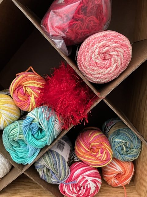 Skeins of yarn on display at FabMo, a creative reuse center, in various colors