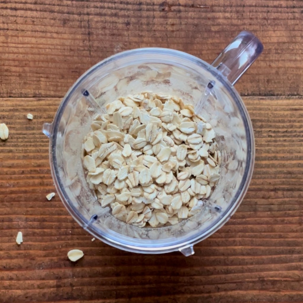Rolled oats fill a Magic Bullet cup halfway