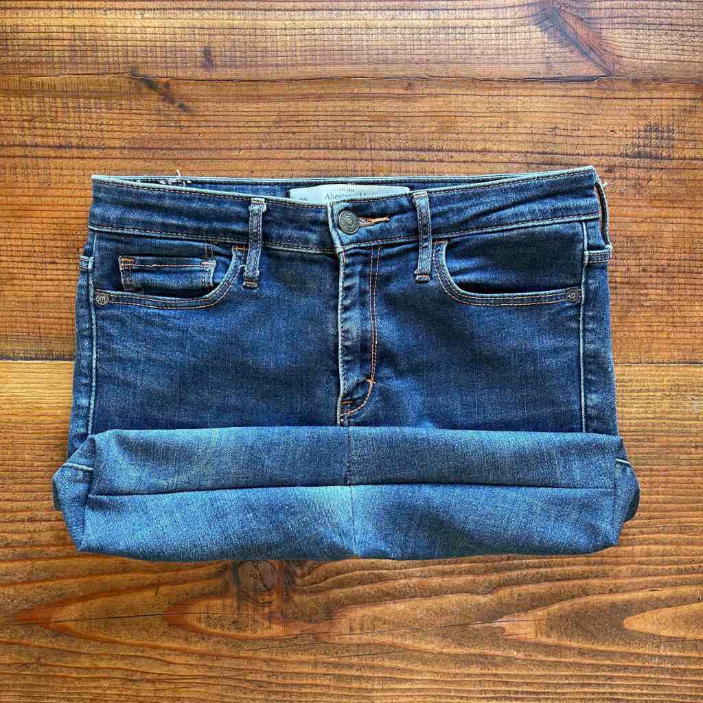 View of a flat bottom sewn into a denim shopping bag made out of old jeans. The handles have not been sewn on yet.